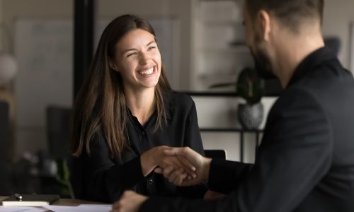 Happy business customer shaking hands